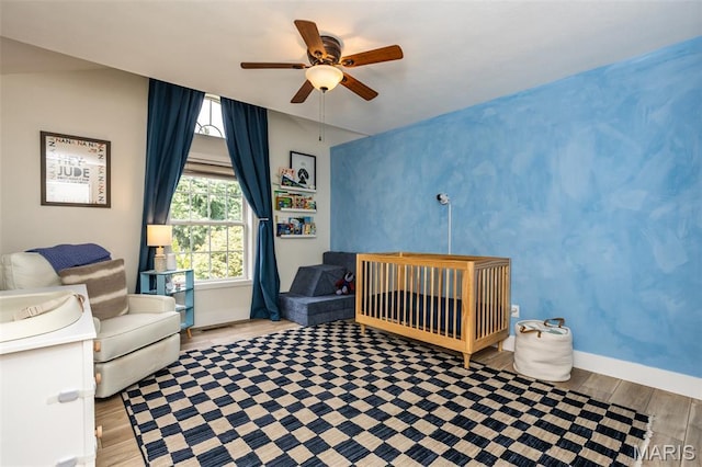 101 Archview Dr, Shiloh, IL 62221 - bedroom featuring wood finished floors, a ceiling fan, and a nursery area
