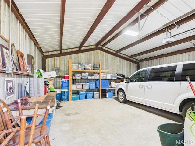 7603 Blue Moon Rd, Bucyrus, MO 65444 - garage with metal wall and a garage door opener
