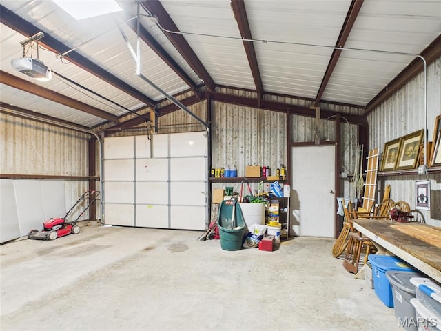 7603 Blue Moon Rd, Bucyrus, MO 65444 - garage with a garage door opener and metal wall