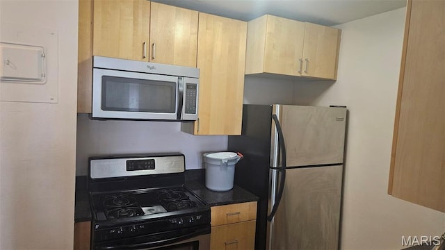 210 N 17th St Unit 905, Saint Louis, MO 63103 - kitchen with appliances with stainless steel finishes and light brown cabinetry