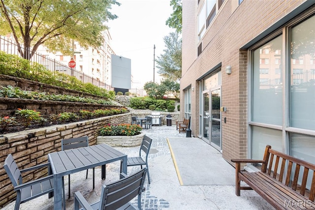 210 N 17th St Unit 905, Saint Louis, MO 63103 - view of patio featuring outdoor dining area and a grill