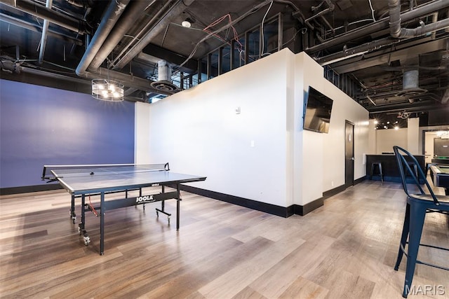 210 N 17th St Unit 905, Saint Louis, MO 63103 - playroom featuring wood finished floors and baseboards