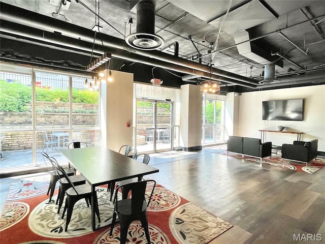 210 N 17th St Unit 905, Saint Louis, MO 63103 - dining space featuring rail lighting and wood finished floors