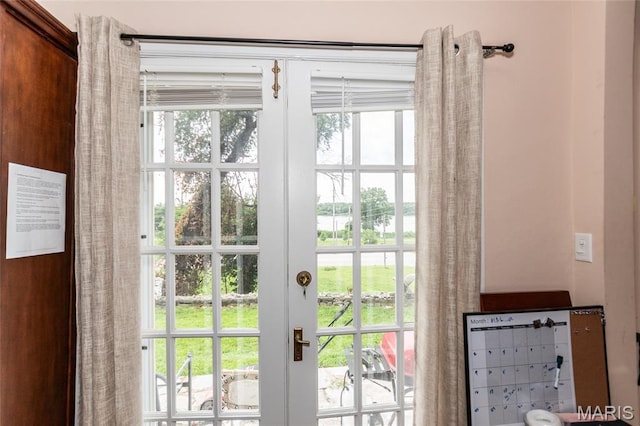 9705 Riverview Dr, Saint Louis, MO 63137 - doorway to outside with a water view