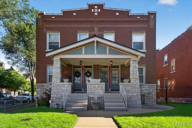 2057-2059 Ann Ave, Saint Louis, MO 63104 - multi unit property featuring covered porch, stone siding, and brick siding