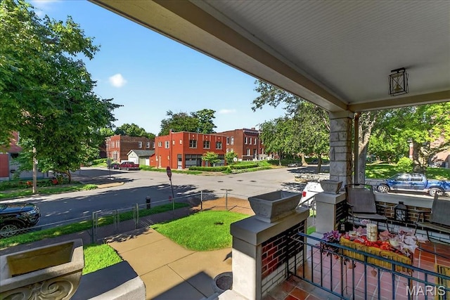 2057-2059 Ann Ave, Saint Louis, MO 63104 - covered porch featuring a residential view