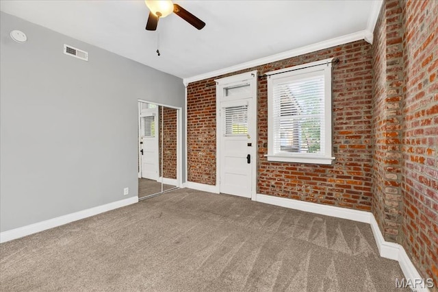 2057-2059 Ann Ave, Saint Louis, MO 63104 - carpeted empty room featuring ceiling fan, brick wall, a smoke detector, and ornamental molding