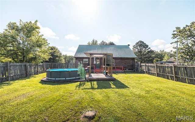 19612 State Route M, Edgar Springs, MO 65462 - back of house featuring a wooden deck, log exterior, a fenced backyard, and a metal roof