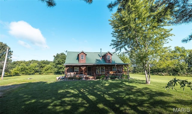 19612 State Route M, Edgar Springs, MO 65462 - view of front of property featuring a porch, a front yard, a metal roof, and log siding