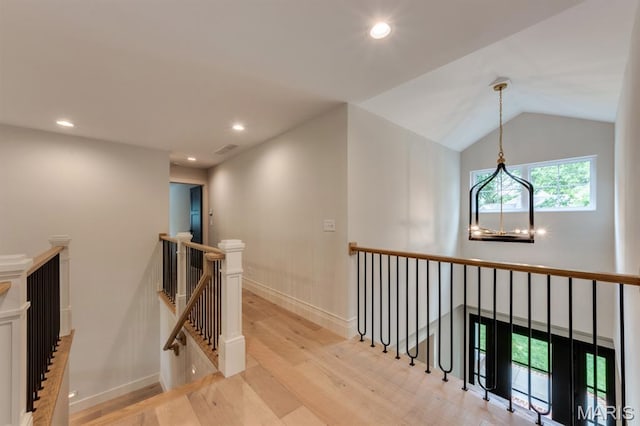 224 Oak Tree Dr, Webster Groves, MO 63119 - hall featuring an upstairs landing, light wood finished floors, recessed lighting, vaulted ceiling, and a chandelier