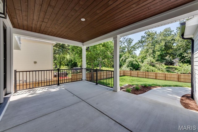 224 Oak Tree Dr, Webster Groves, MO 63119 - fenced backyard with a patio and view of scattered trees