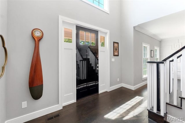 12429 Nicholas Ln, Saint Louis, MO 63131 - entryway featuring stairway, wood finished floors, and crown molding