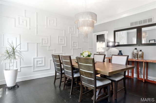 12429 Nicholas Ln, Saint Louis, MO 63131 - dining space featuring crown molding and a chandelier