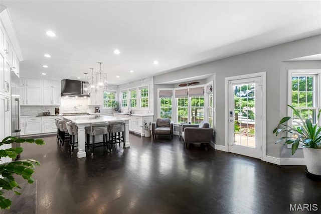 12429 Nicholas Ln, Saint Louis, MO 63131 - dining space featuring recessed lighting, dark wood-style flooring, and a chandelier