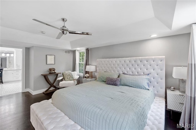 12429 Nicholas Ln, Saint Louis, MO 63131 - bedroom featuring dark wood-style floors, ceiling fan, ensuite bath, a tray ceiling, and recessed lighting