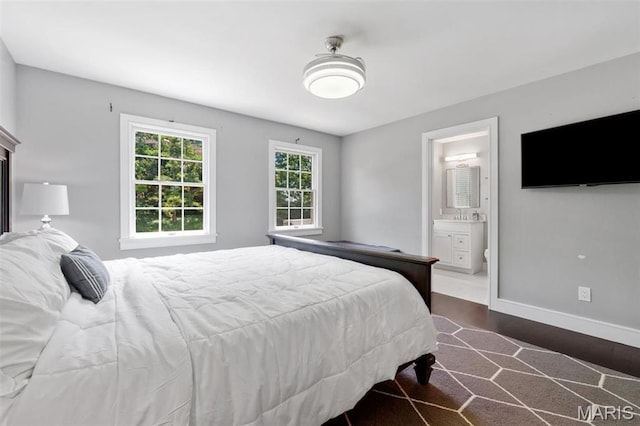 12429 Nicholas Ln, Saint Louis, MO 63131 - bedroom with wood finished floors and ensuite bathroom