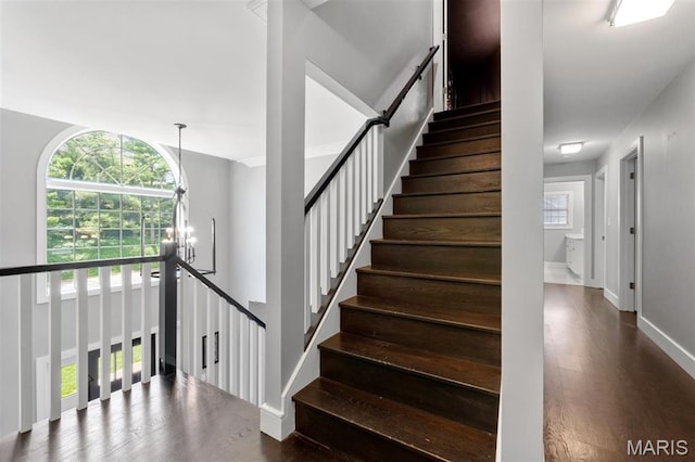 12429 Nicholas Ln, Saint Louis, MO 63131 - staircase with a chandelier and wood finished floors