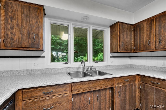 1938 State Highway Oo, Whitewater, MO 63785 - kitchen featuring light countertops, decorative backsplash, dark brown cabinets, and black dishwasher