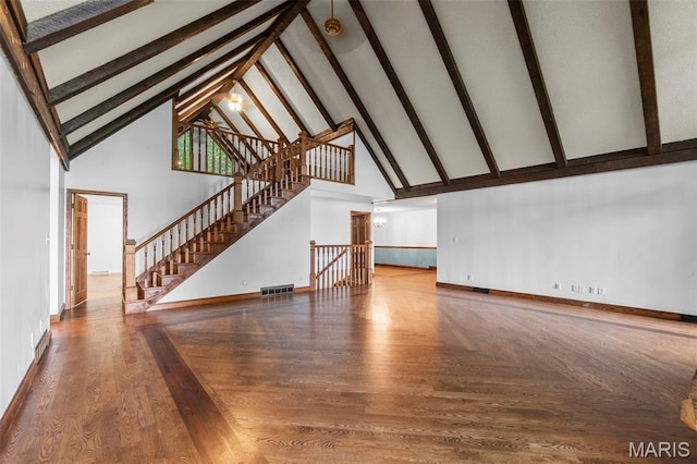 1938 State Highway Oo, Whitewater, MO 63785 - unfurnished living room with high vaulted ceiling, beam ceiling, and wood finished floors