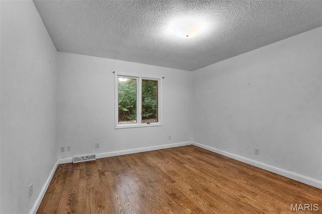 1938 State Highway Oo, Whitewater, MO 63785 - unfurnished room featuring a textured ceiling and wood finished floors