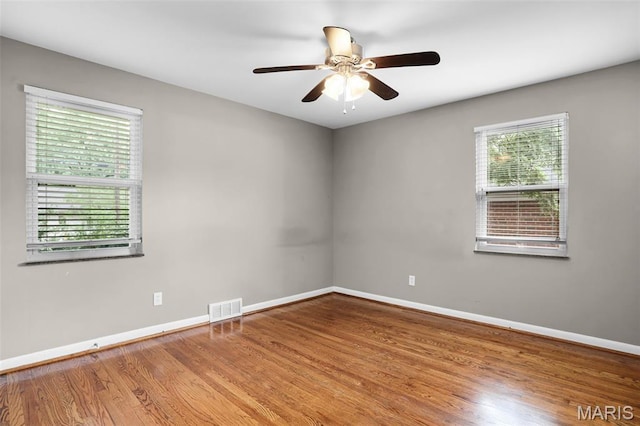 11380 Manchester Rd, Kirkwood, MO 63122 - unfurnished room with wood finished floors and a ceiling fan