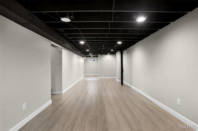 11380 Manchester Rd, Kirkwood, MO 63122 - finished basement featuring wood finished floors and baseboards