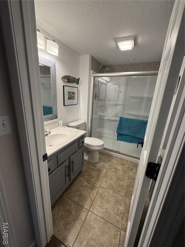 611 Lazy Days Rd Unit Z-1, Osage Beach, MO 65065 - bathroom with vanity, a stall shower, and a textured ceiling