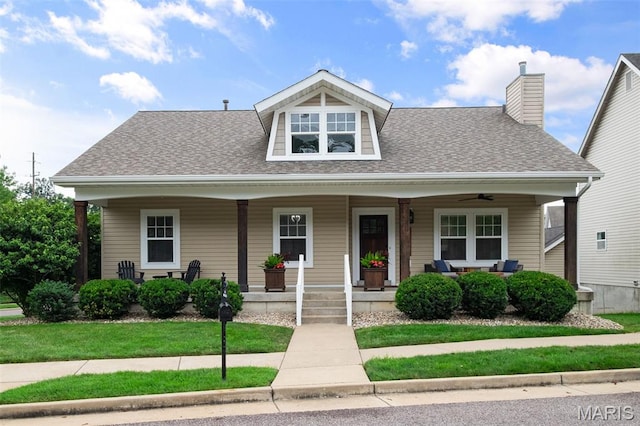 17108 Windsor Crest Blvd, Wildwood, MO 63038 - bungalow-style house featuring roof with shingles, a porch, a ceiling fan, and a chimney