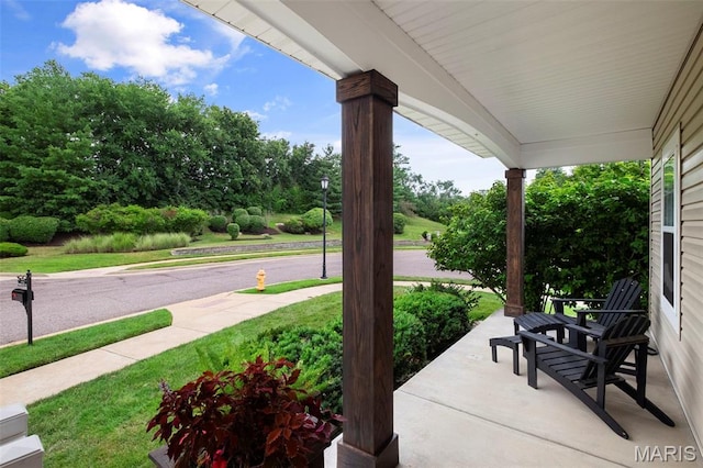 17108 Windsor Crest Blvd, Wildwood, MO 63038 - covered porch with view of wooded area