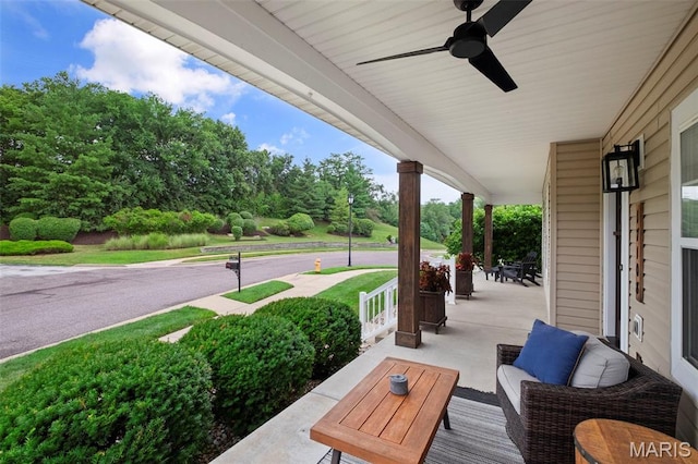 17108 Windsor Crest Blvd, Wildwood, MO 63038 - covered porch featuring view of wooded area and ceiling fan