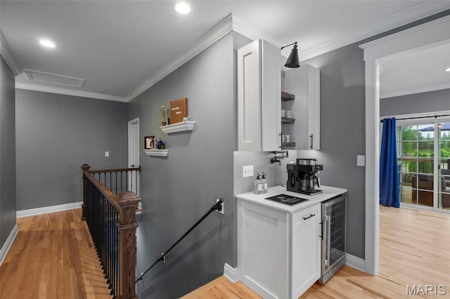 17108 Windsor Crest Blvd, Wildwood, MO 63038 - bar with light wood-style floors, wine cooler, crown molding, and recessed lighting