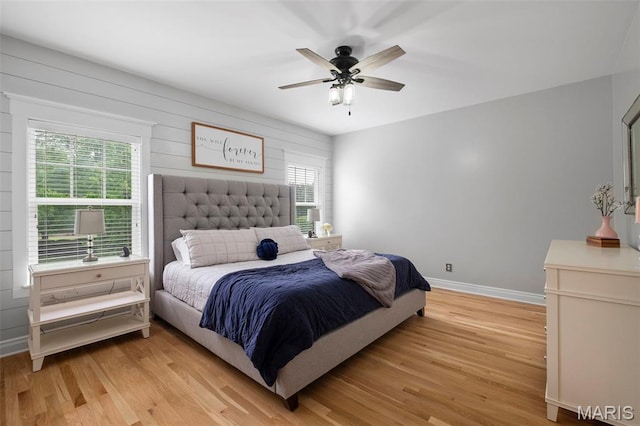 17108 Windsor Crest Blvd, Wildwood, MO 63038 - bedroom featuring multiple windows, light wood-type flooring, and a ceiling fan