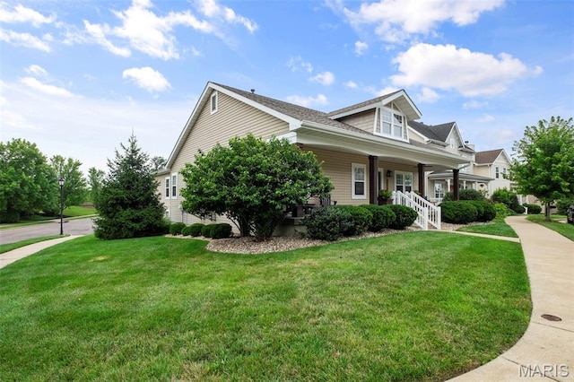 17108 Windsor Crest Blvd, Wildwood, MO 63038 - view of property exterior with a lawn and covered porch