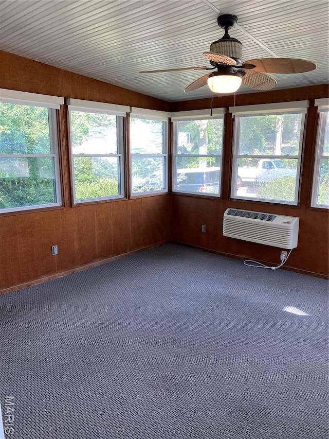 12020 Jacobson Ct, Saint Louis, MO 63044 - unfurnished sunroom with plenty of natural light, carpet, wood walls, and a wall unit AC