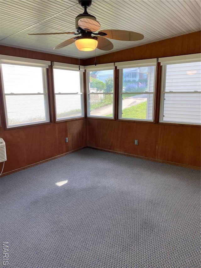 12020 Jacobson Ct, Saint Louis, MO 63044 - unfurnished sunroom featuring carpet flooring and wood walls