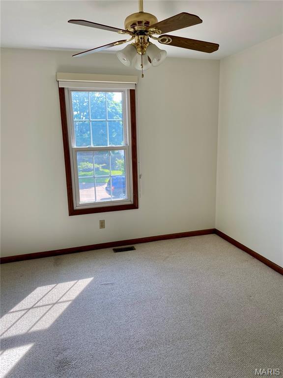 12020 Jacobson Ct, Saint Louis, MO 63044 - carpeted spare room featuring baseboards and a ceiling fan