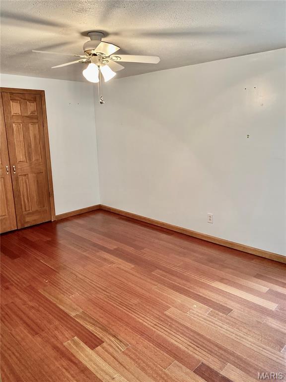 12020 Jacobson Ct, Saint Louis, MO 63044 - spare room with a ceiling fan, light wood-type flooring, and a textured ceiling