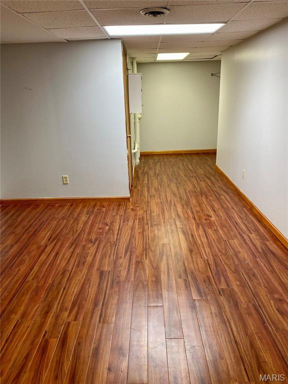 12020 Jacobson Ct, Saint Louis, MO 63044 - spare room featuring a drop ceiling and wood finished floors