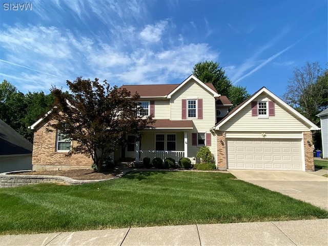 12020 Jacobson Ct, Saint Louis, MO 63044 - traditional home with a garage, a front yard, brick siding, and covered porch