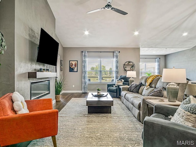 714 Applewood Creek Dr, Fairview Heights, IL 62208 - living room with wood finished floors, a glass covered fireplace, a ceiling fan, and recessed lighting