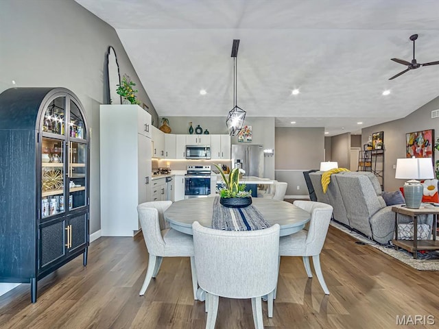 714 Applewood Creek Dr, Fairview Heights, IL 62208 - dining area with dark wood-style flooring, a ceiling fan, recessed lighting, and vaulted ceiling