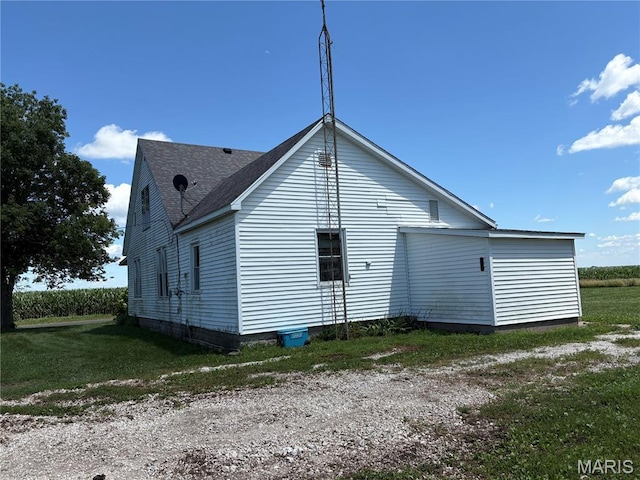 98 SW 200th Ave, Carrollton, IL 62016 - view of side of home featuring a shingled roof