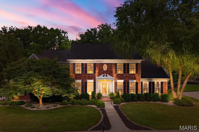 218 W Stonybrook Dr, Ofallon, IL 62269 - colonial-style house featuring brick siding and a lawn