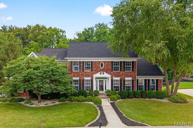 218 W Stonybrook Dr, Ofallon, IL 62269 - georgian-style home with a front lawn and brick siding