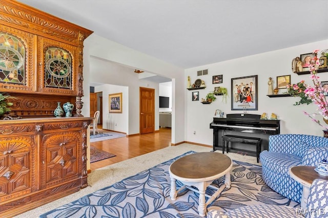 218 W Stonybrook Dr, Ofallon, IL 62269 - carpeted living room with wood finished floors and baseboards