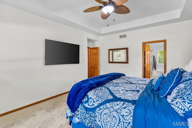 218 W Stonybrook Dr, Ofallon, IL 62269 - bedroom featuring carpet flooring, a tray ceiling, ceiling fan, and connected bathroom