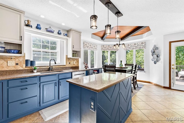 218 W Stonybrook Dr, Ofallon, IL 62269 - kitchen featuring blue cabinetry, open shelves, light tile patterned floors, a tray ceiling, and decorative backsplash