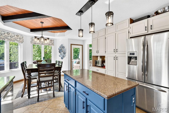 218 W Stonybrook Dr, Ofallon, IL 62269 - kitchen featuring appliances with stainless steel finishes, blue cabinetry, a kitchen island, wooden ceiling, and white cabinetry