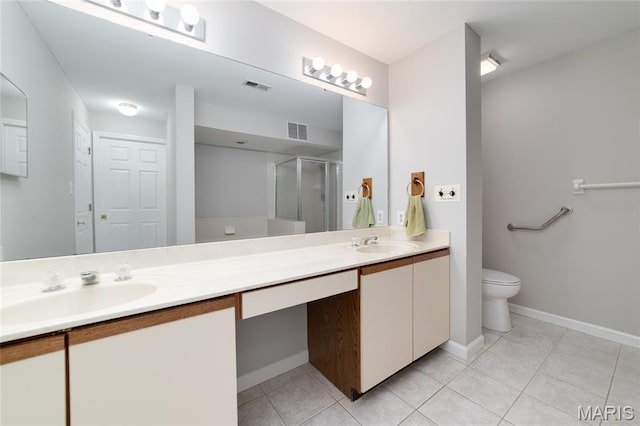 1632 Lake Knoll Dr Unit 1P, Lake St Louis, MO 63367 - bathroom featuring double vanity, a shower stall, and tile patterned floors