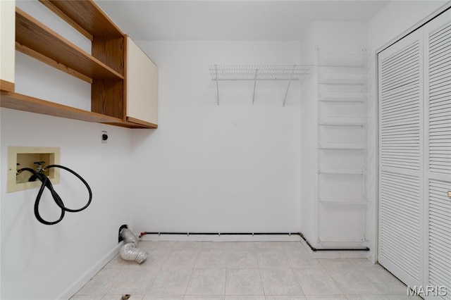 1632 Lake Knoll Dr Unit 1P, Lake St Louis, MO 63367 - laundry area featuring hookup for a washing machine, electric dryer hookup, and light tile patterned floors